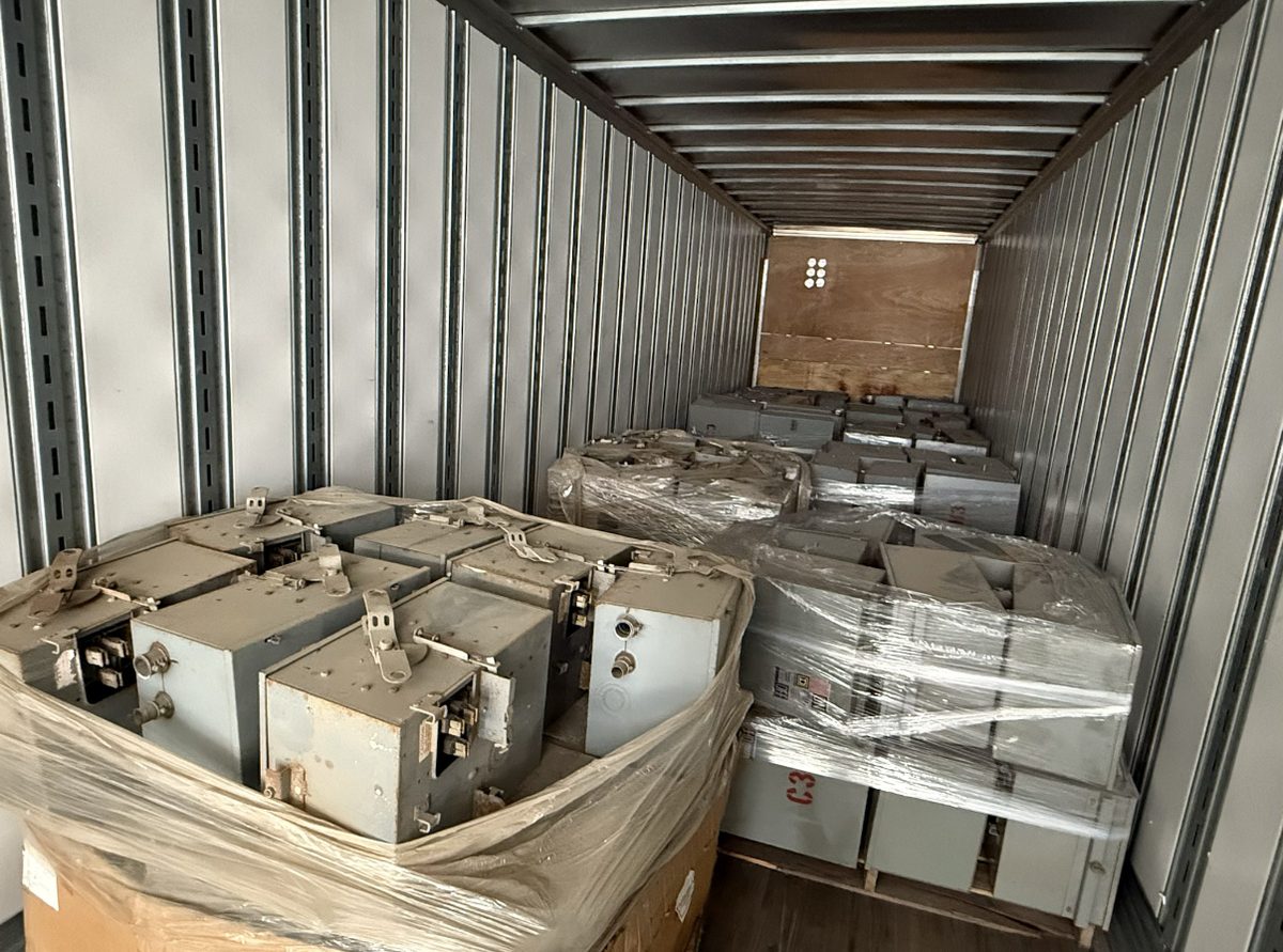 Trailer loaded with palletized electrical bus plugs and bus duct sections purchased from a plant teardown
