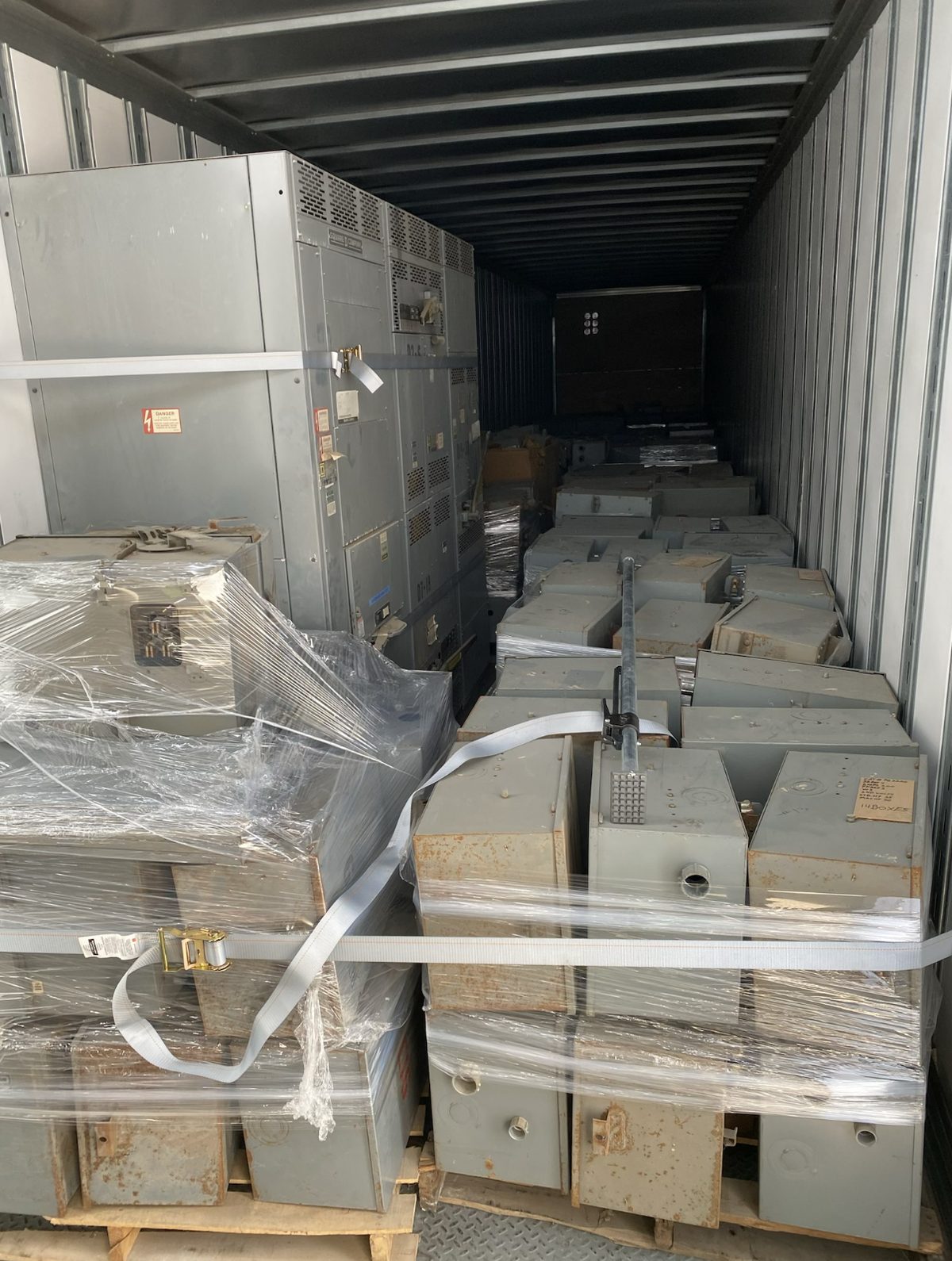 Full truckload of electrical bus plugs and busway strapped and shrink-wrapped after a surplus buyout